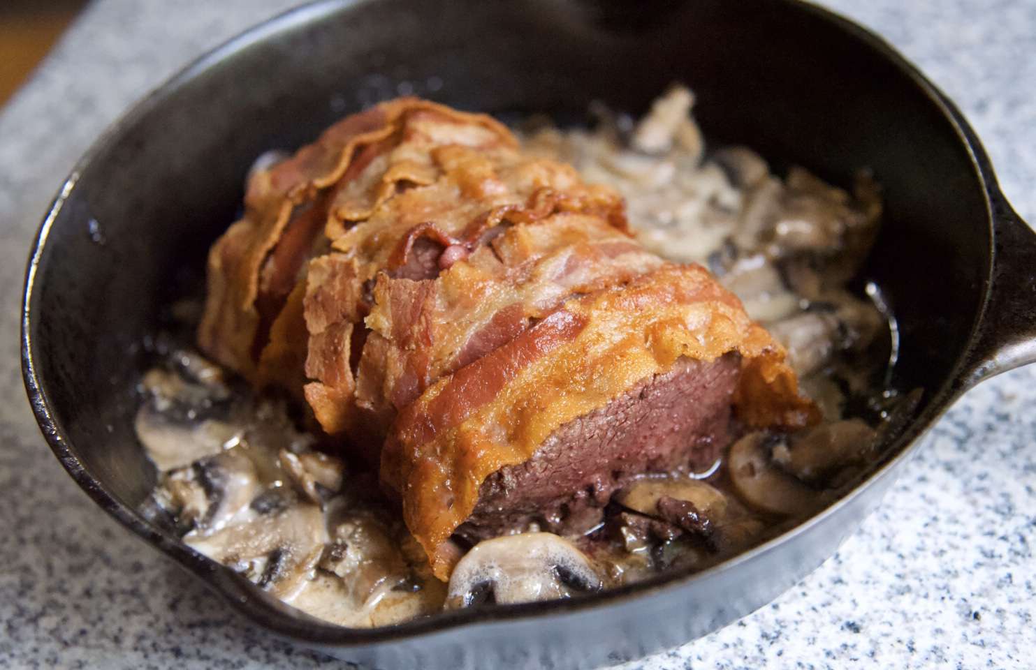 Bacon-Wrapped Venison Tenderloin with Garlic Mushroom Sauce