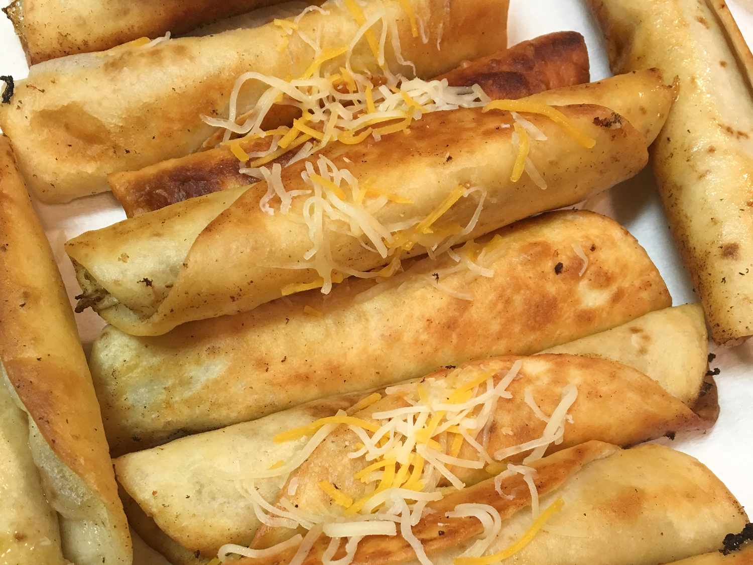 Crispy Chicken Taquitos with Smoked Cheese and Green Salsa