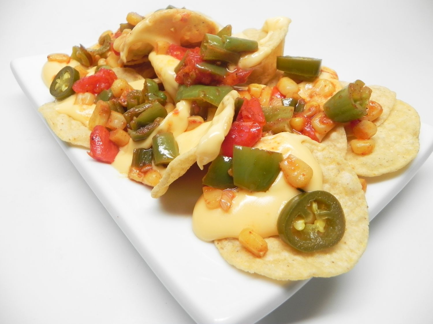 Loaded Veggie Nachos with Peppers and Corn