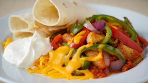 Spicy Veggie Fajitas with Cheese and Sour Cream