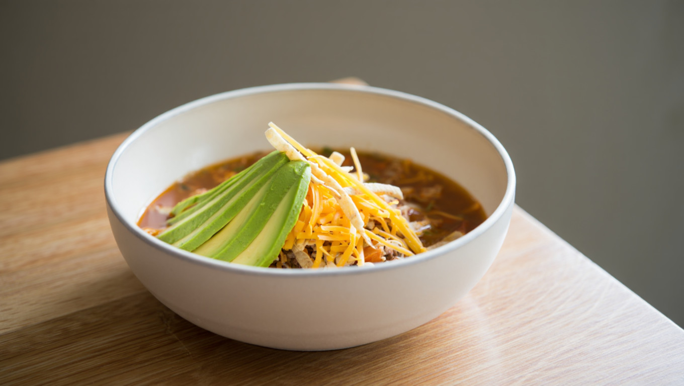 Vegetarian Tortilla Soup with Avocado and Cheese
